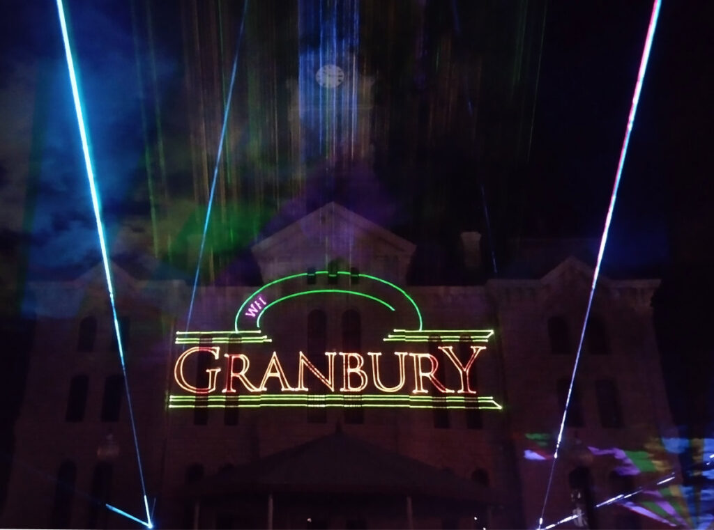 Granbury Logo projected upon the Hood County Courthouse